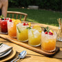 Colorful cocktails with fresh fruit and ice, perfect for mindful cooking & well-being at outdoor gatherings