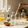 Glass bottle cleaner effortlessly scrubs bottles for cocktail, wine, and BBQ lovers seeking spotless glassware
