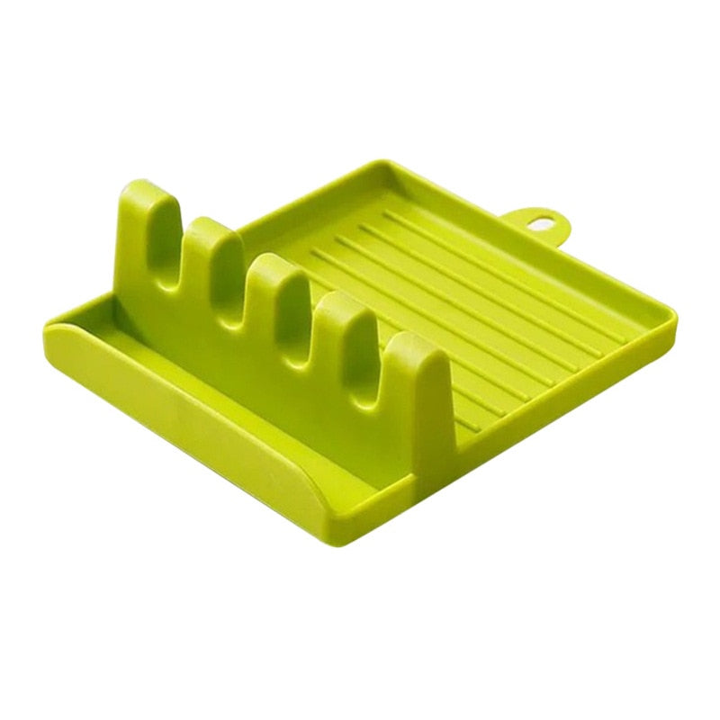 Plastic spoon holder for kitchen storage and utensil organization, green color.