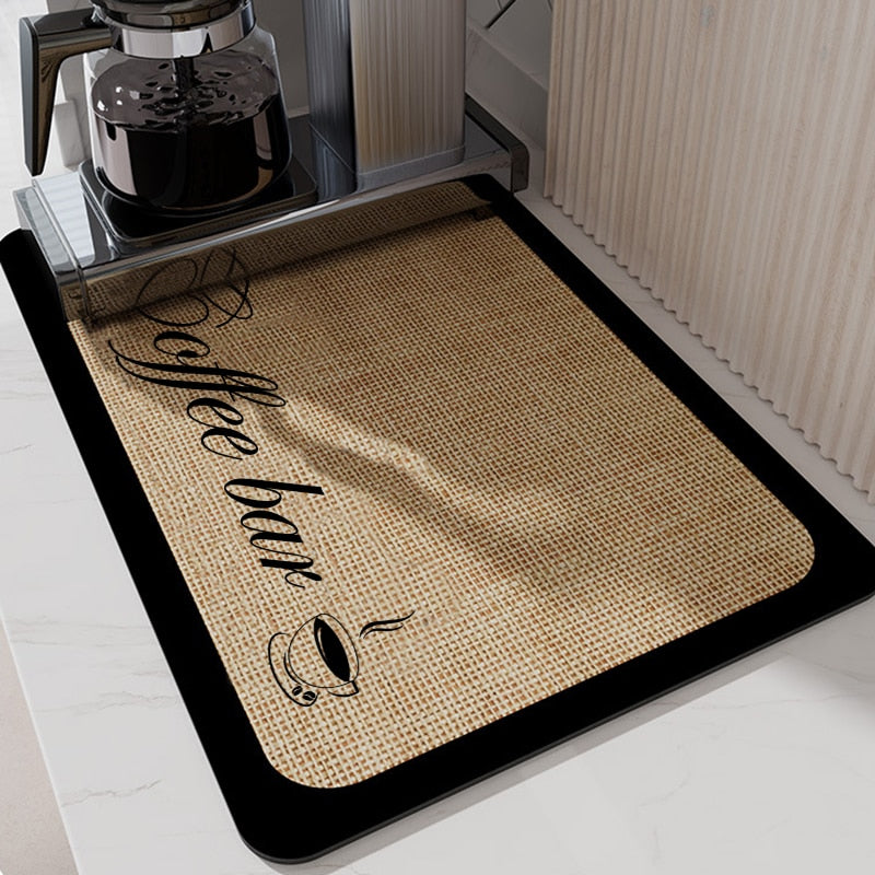 Absorbent kitchen dish drying mat with coffee bar design placed on a countertop.