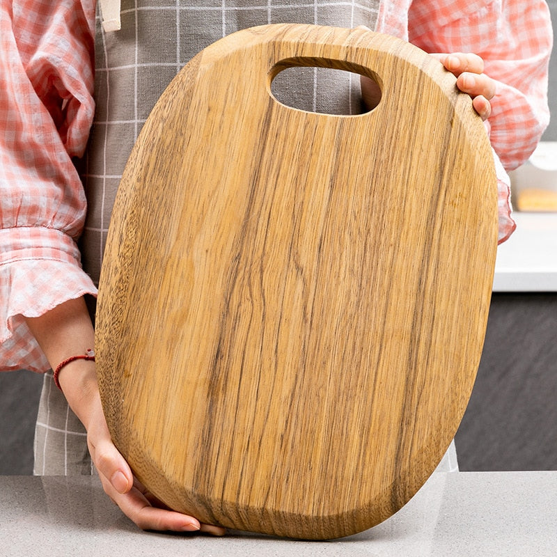 Premium wooden chopping board with handle, versatile kitchen tool for food preparation and charcuterie displays.