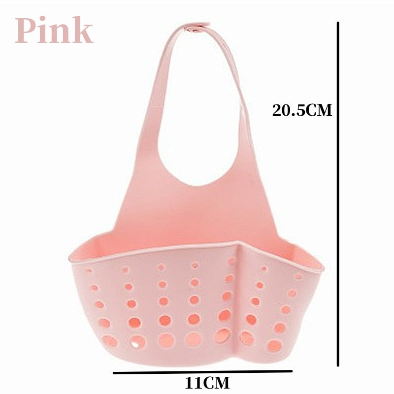 Pink adjustable storage drain basket sink holder with holes for drainage.