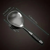 Metallic kitchen spatula with measurements on a dark background