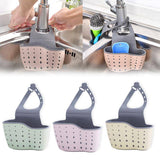 Adjustable storage drain basket sink holder with drainage holes and durable plastic design for kitchen organization.