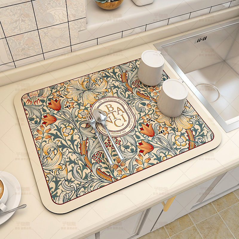 Large kitchen super absorbent draining drying mat on countertop with cups and spoons, decorative floral pattern.