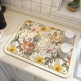 Large kitchen super absorbent draining drying mat with floral design on a countertop.