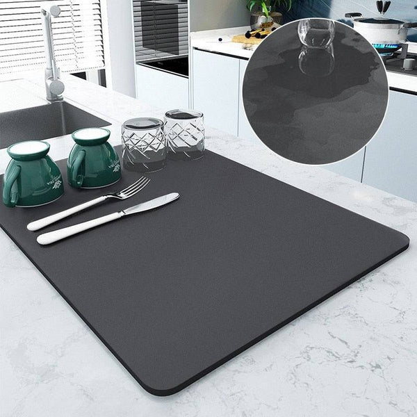 Large kitchen super absorbent draining drying mat in use, showing water absorption and dish drying on countertop.