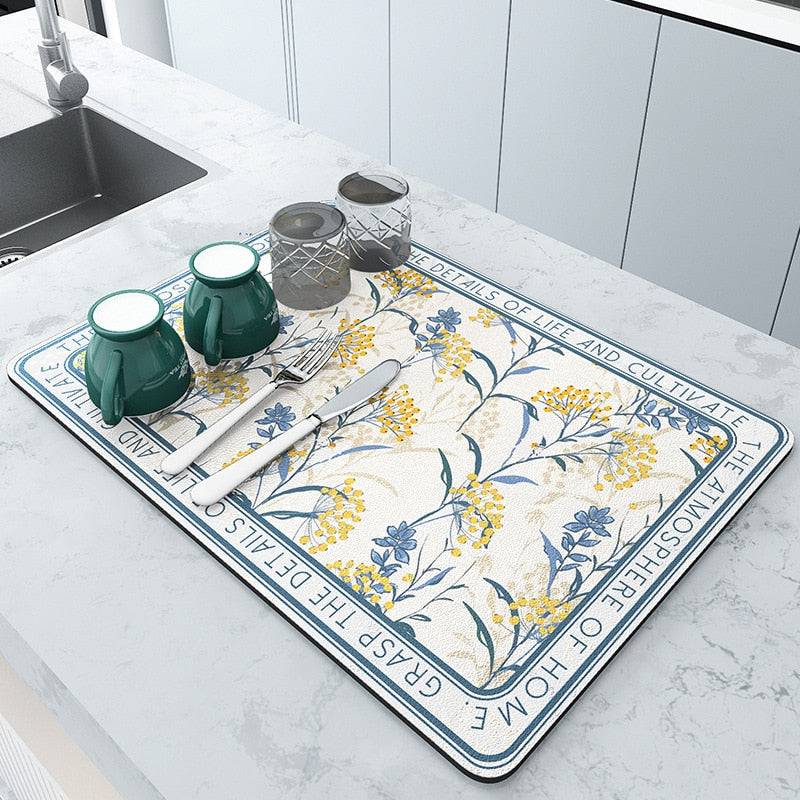 Large kitchen super absorbent draining drying mat with floral design on countertop.