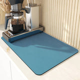 Large kitchen super absorbent draining drying mat under coffee maker on countertop.