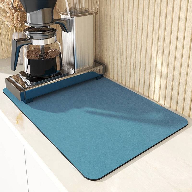 Large kitchen super absorbent draining drying mat under coffee maker on countertop.