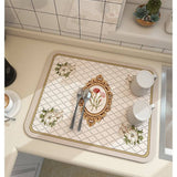Large kitchen super absorbent draining drying mat with floral pattern on countertop.