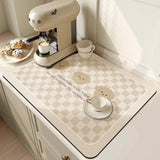 Large kitchen super absorbent draining drying mat on countertop with coffee machine and pastries.