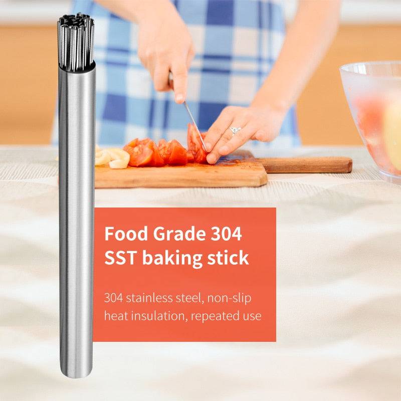 Stainless steel barbecue skewer storage tube and flat BBQ fork for kitchen grilling.