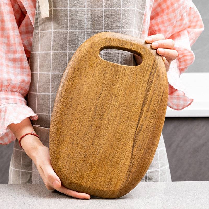 High-quality wooden chopping board with handle, perfect for versatile kitchen tasks.