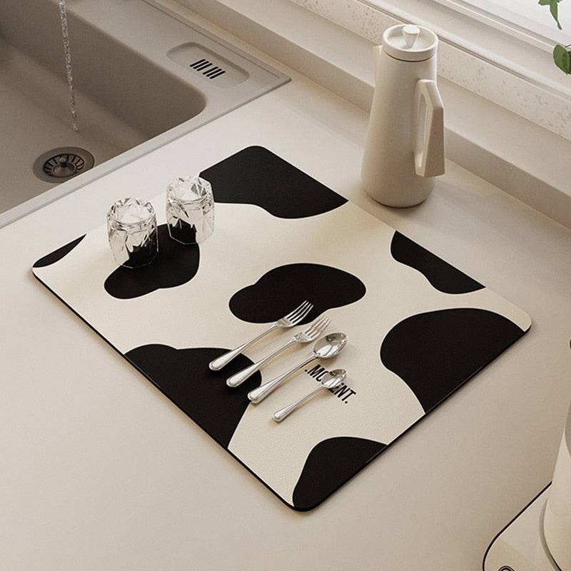 Absorbent kitchen dish drying mat with stylish design, made from durable crystal velvet material, ideal for drying and preventing mold.
