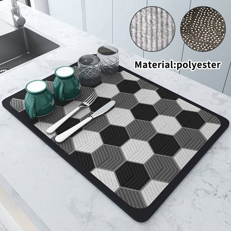 Kitchen dish drying mat with absorbent crystal velvet material and non-slip design, featuring black and gray hexagonal pattern.