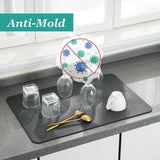 Super Absorbent Drainer Mats on countertop with glasses and utensils, featuring anti-mold properties.