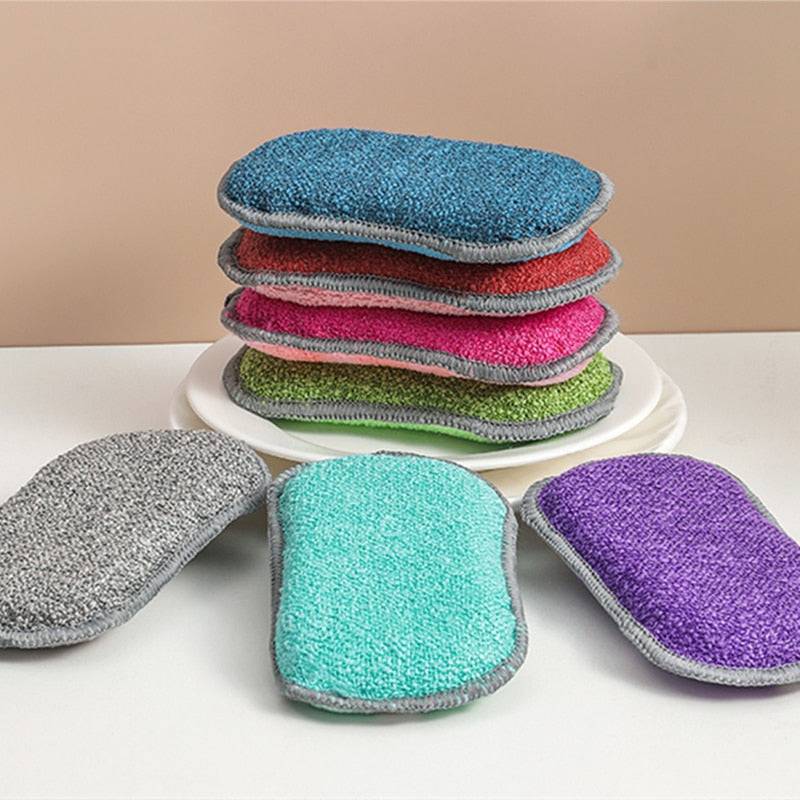 Reusable magic sponge double sided eraser in various colors on a table.