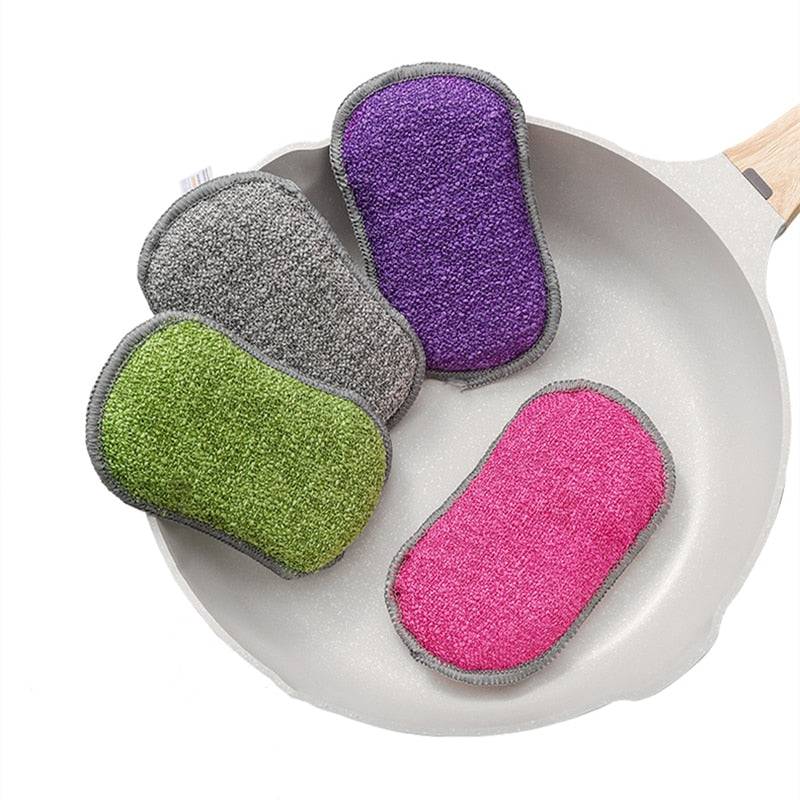 Reusable Magic Sponge Double Sided Eraser in assorted colors on a pan.