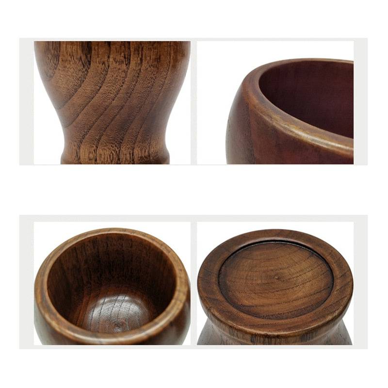 Bamboo wooden mortar and pestle set for grinding spices, close-up view.