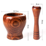 Bamboo wooden mortar and pestle set for grinding spices and herbs, featuring ergonomic design and natural style.