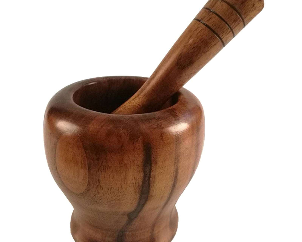 Bamboo wooden mortar and pestle set for grinding spices and herbs.