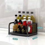 Stainless steel kitchen storage rack for seasoning and utensils, with bottles displayed.
