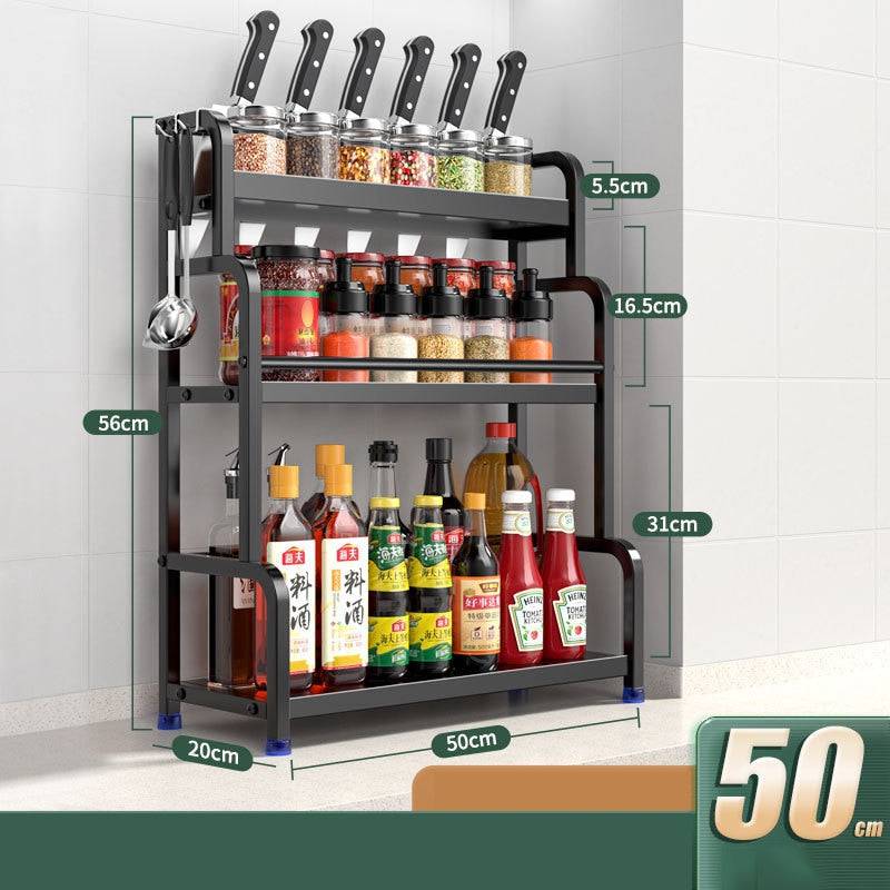 Stainless steel kitchen storage rack with three tiers for seasoning jars, chopsticks, knives, and bottles.