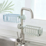 Sink faucet storage organizer in blue and gray, featuring a hollow design for easy draining, suitable for kitchen or bathroom storage.