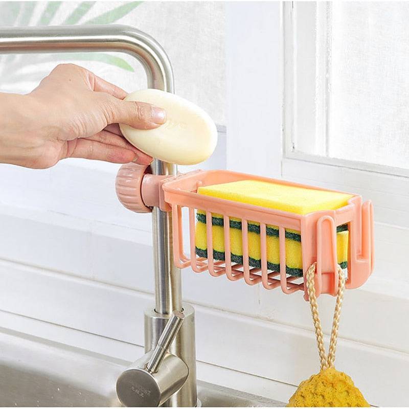 Sink sponge soap cloth drain rack storage organizer in use on faucet.