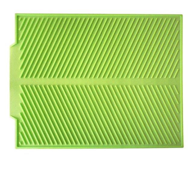 Foldable insulated soft rubber sink mat in green for kitchen use, anti-slip and heat-resistant.