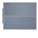 Foldable insulated soft rubber sink mat in gray, anti-slip, kitchen use.