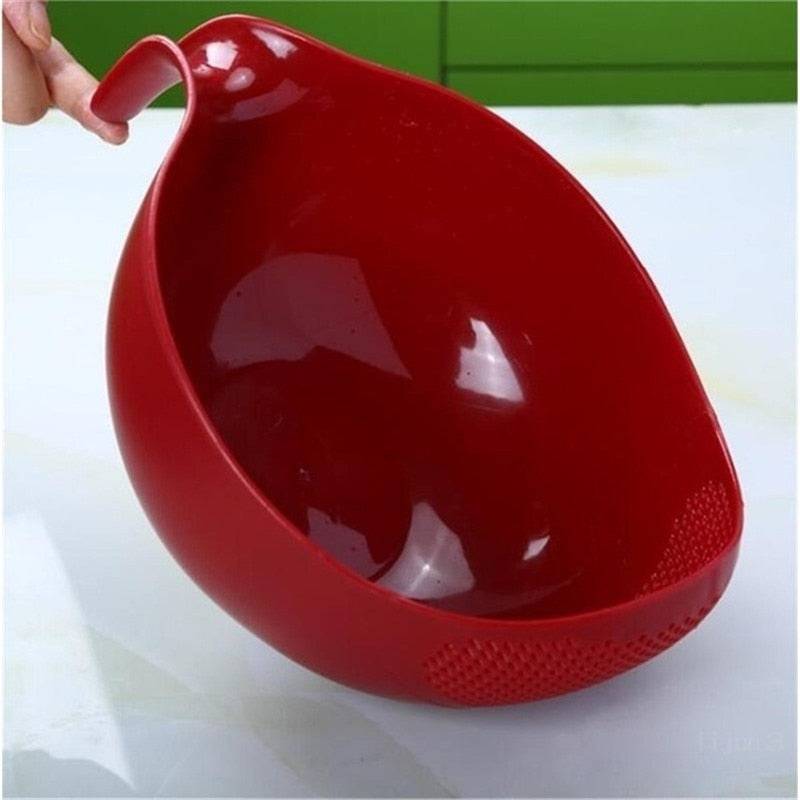 Red rice washer and quinoa strainer with handle for cleaning veggies and fruits.