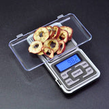 High-precision portable handheld electronic weighing jewelry scale with backlit display showing weight in grams.