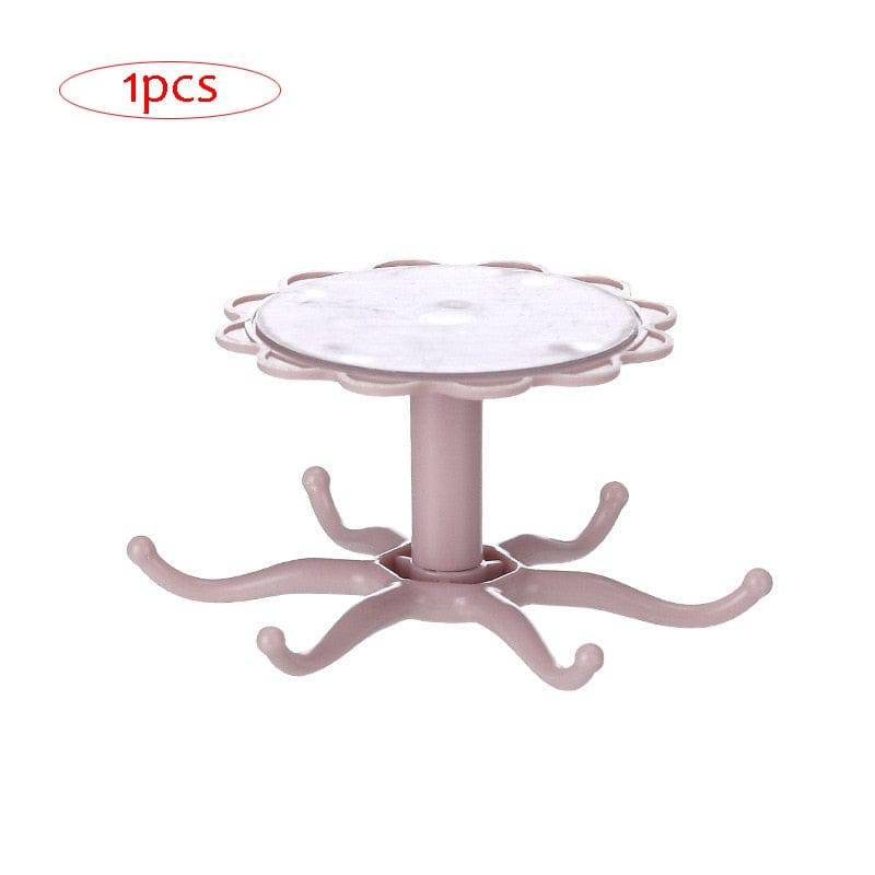 Rotatable kitchen cabinet organizer hook in pink with multiple arms for hanging kitchen utensils.