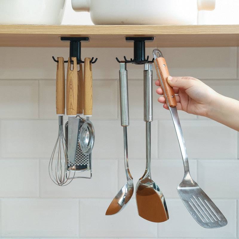 Rotating kitchen or cabinet organizer hook for utensil storage.