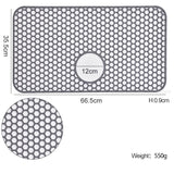 Silicone sink protector mat dimensions with honeycomb pattern and central hole, measures 66.5cm x 35.5cm.