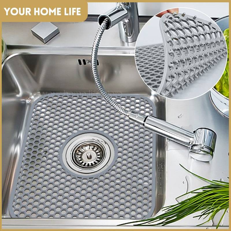 Silicone sink protector mat in stainless steel sink for kitchen use, heat resistant, non-rusting, 34x29cm.