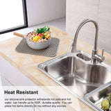 Sink protector in kitchen sink, heat-resistant silicone mat, durable up to 500°F, perfect for stainless steel sink protection.