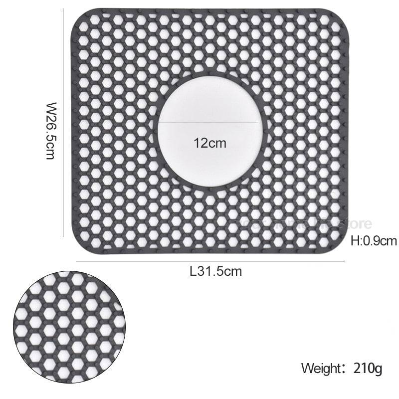 Silicone sink protector mat with honeycomb design, measuring 31.5cm x 26.5cm, weight 210g.