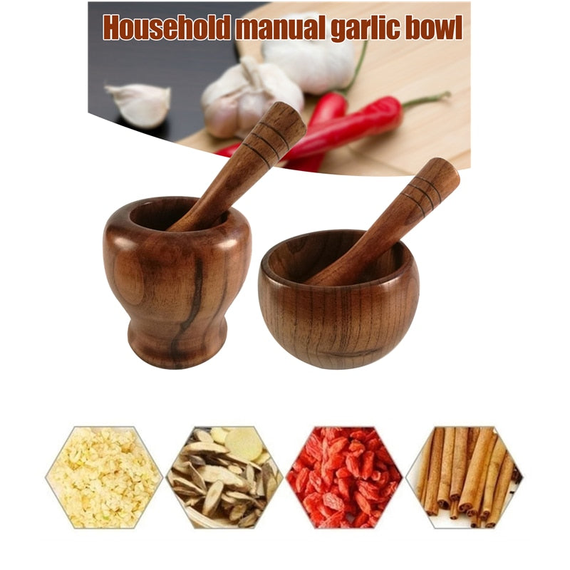 Bamboo wooden mortar and pestle set for grinding spices and herbs with garlic and chili.