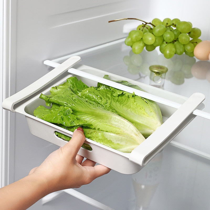 Hanging refrigerator drawer storage box for eggs and vegetables in white.